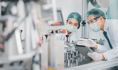 Both,Male,And,Female,Asian,Scientists,Are,Outfitted,With,Protective