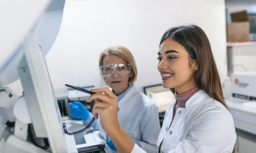 Two,Research,Scientists,Programm,Medical,Equipment,With,Tablet,Computer.,Team